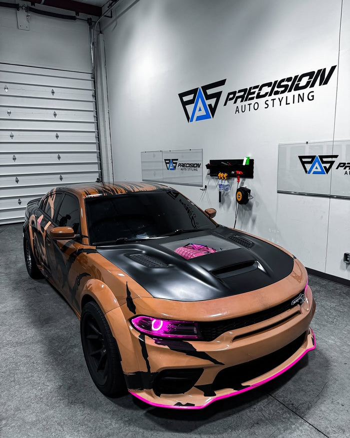 Copper and black custom graphic wrap with pink accents on a widebody Dodge Charger, designed by JCD