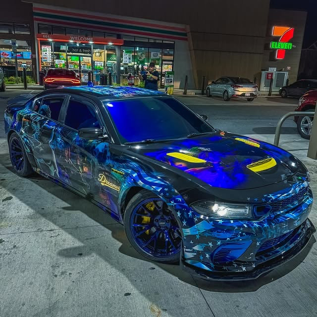Blue stars-and-stripes show wrap with reflective decals on a Dodge Charger, designed by JCD