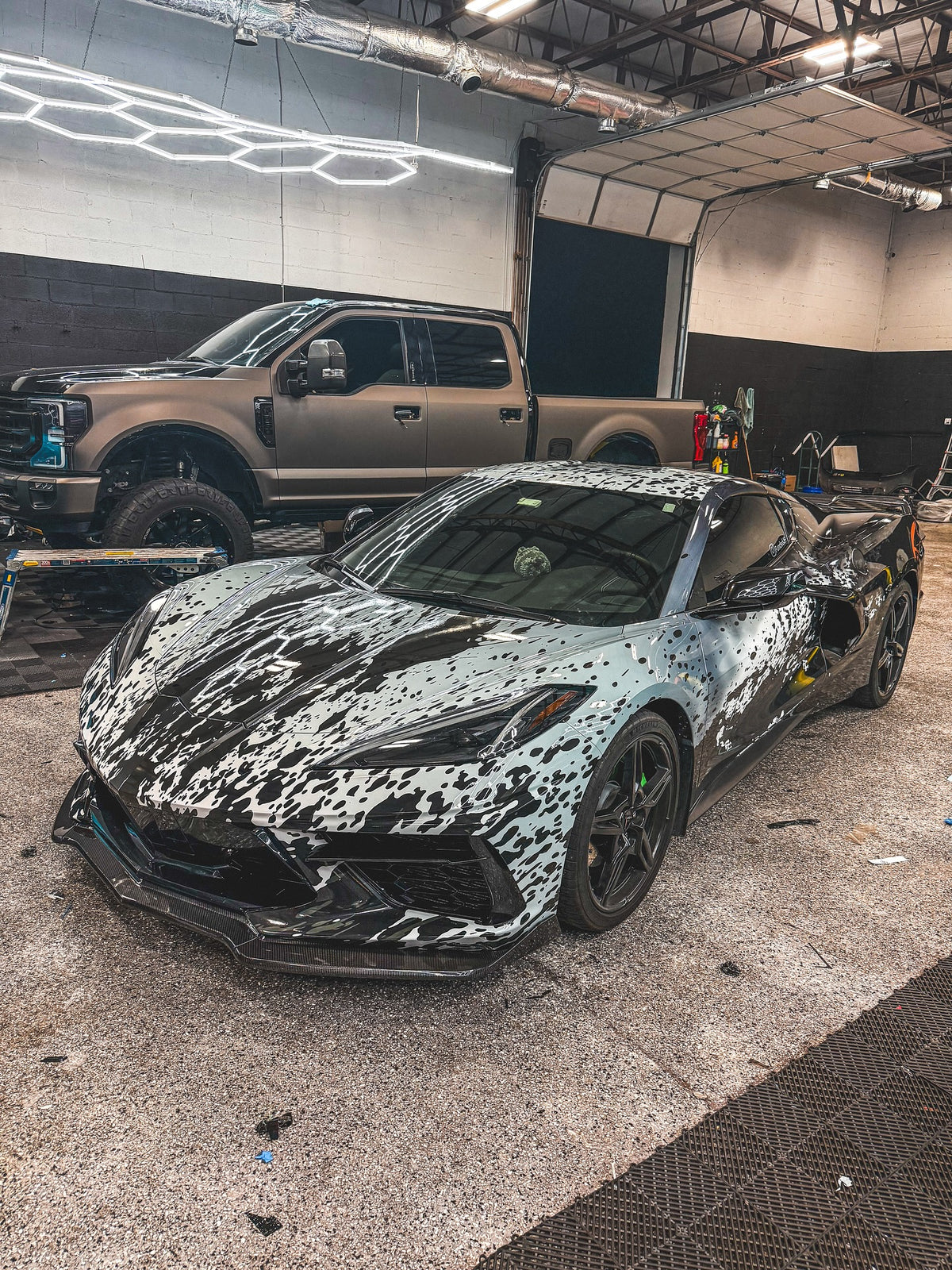 One-of-one abstract wrap on a Chevrolet Corvette C8, designed by Jay's Car Designs