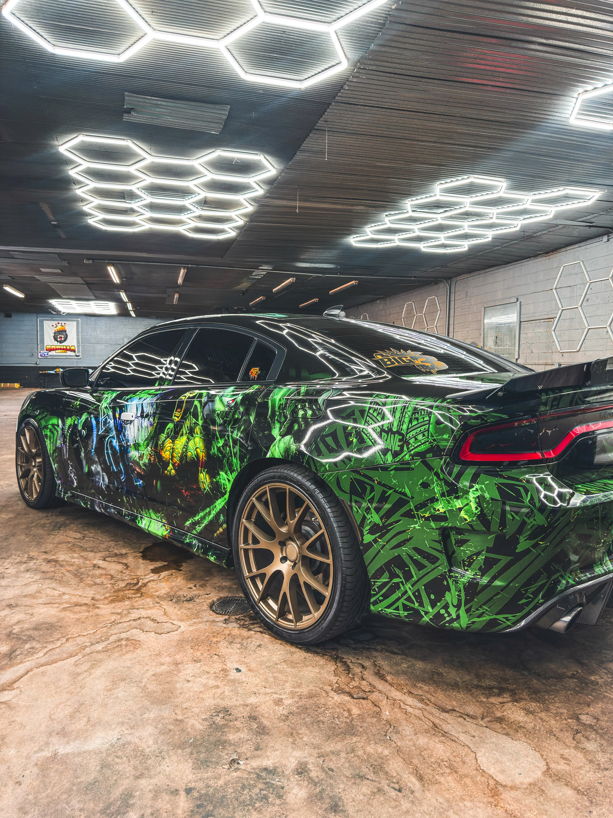Green show wrap on a Dodge Charger with bronze wheels, custom design by Jay's Car Designs