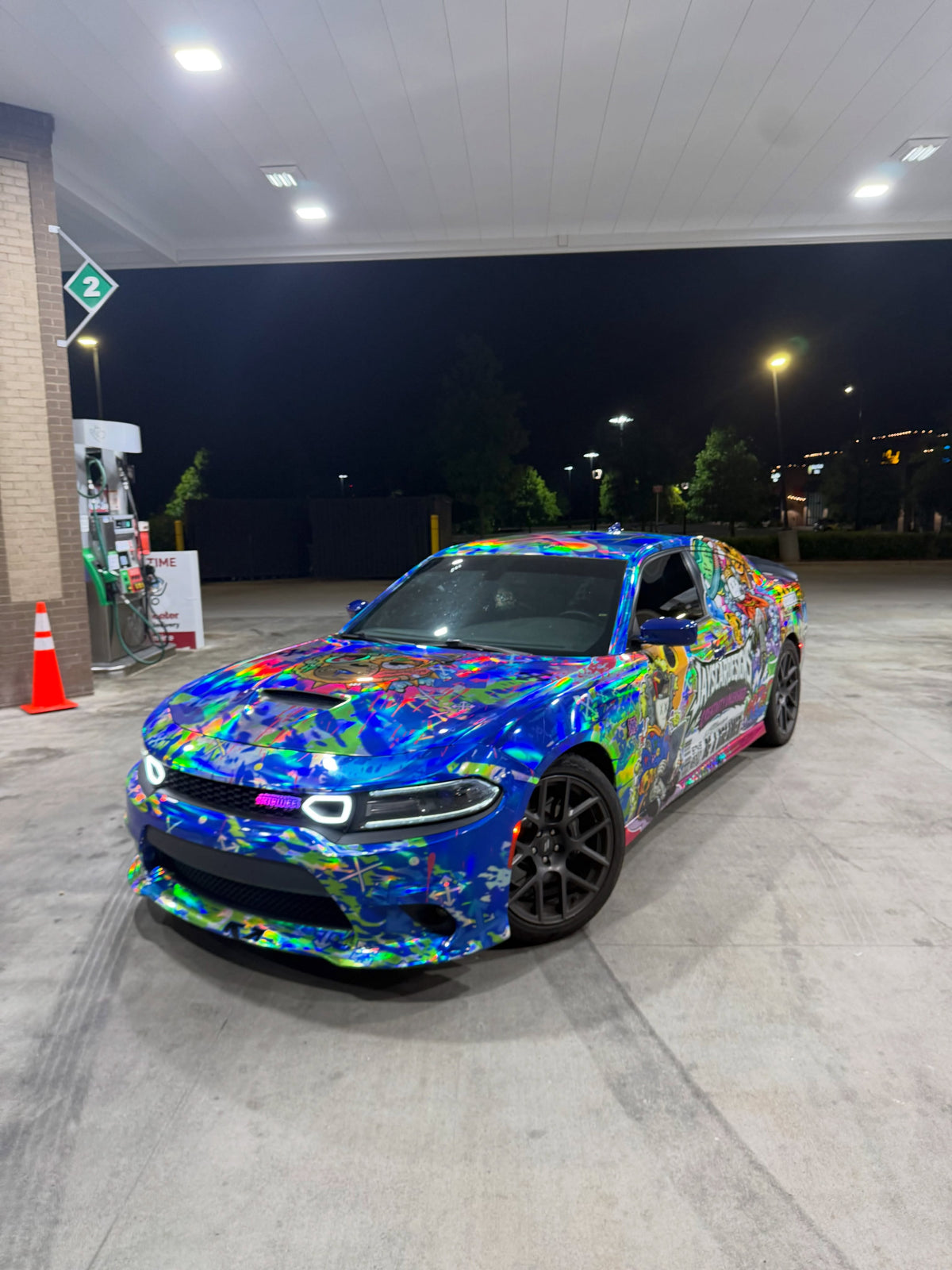 Holographic hand-drawn show wrap on a Dodge Charger Scat Pack at night, designed by Jay's Car Designs