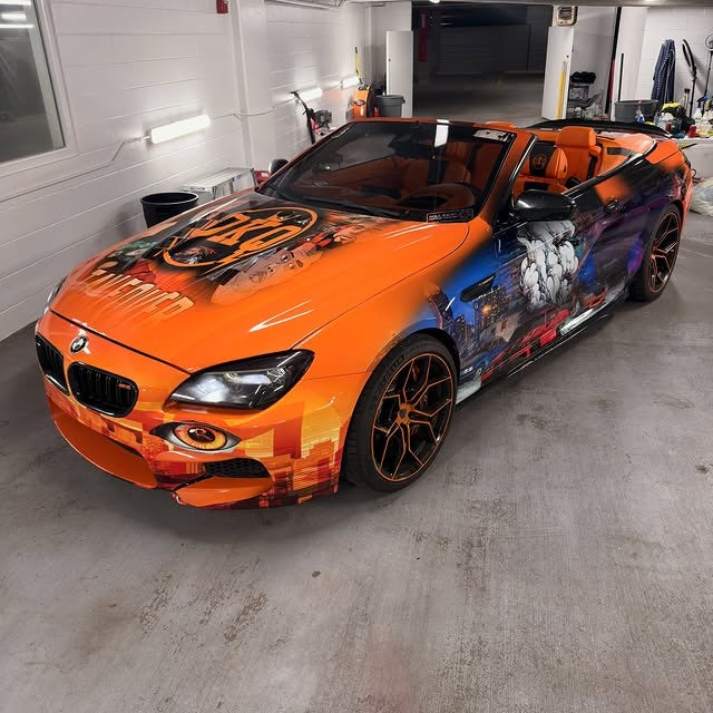 Orange movie-themed show wrap on a BMW M6 convertible, designed by JCD