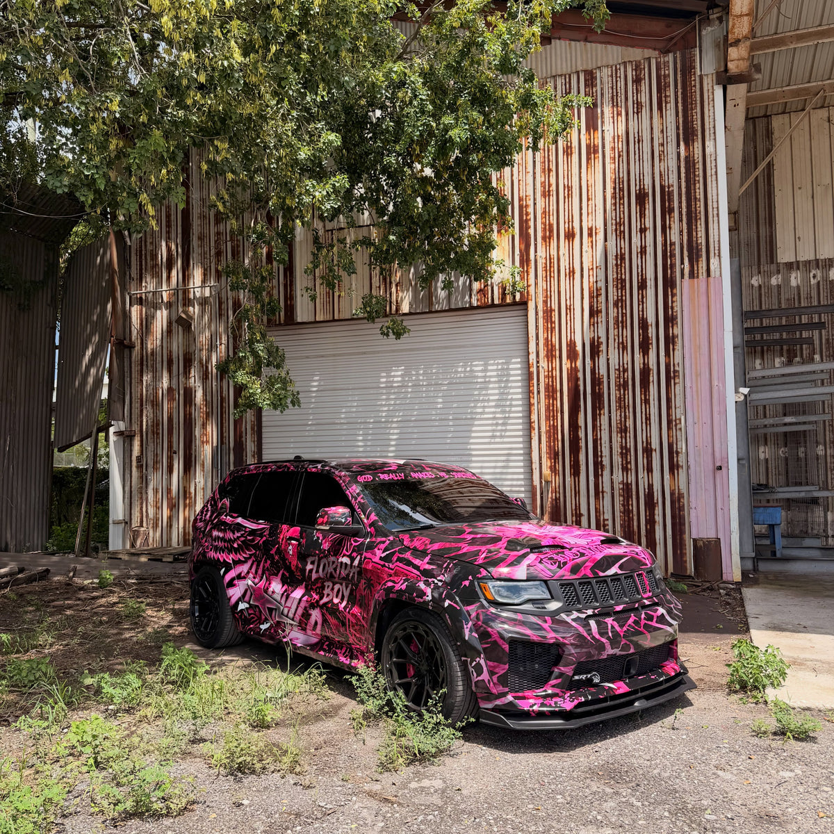 Pink and black Chrome Heart Bape show wrap on a Jeep Grand Cherokee Trackhawk, designed by JCD