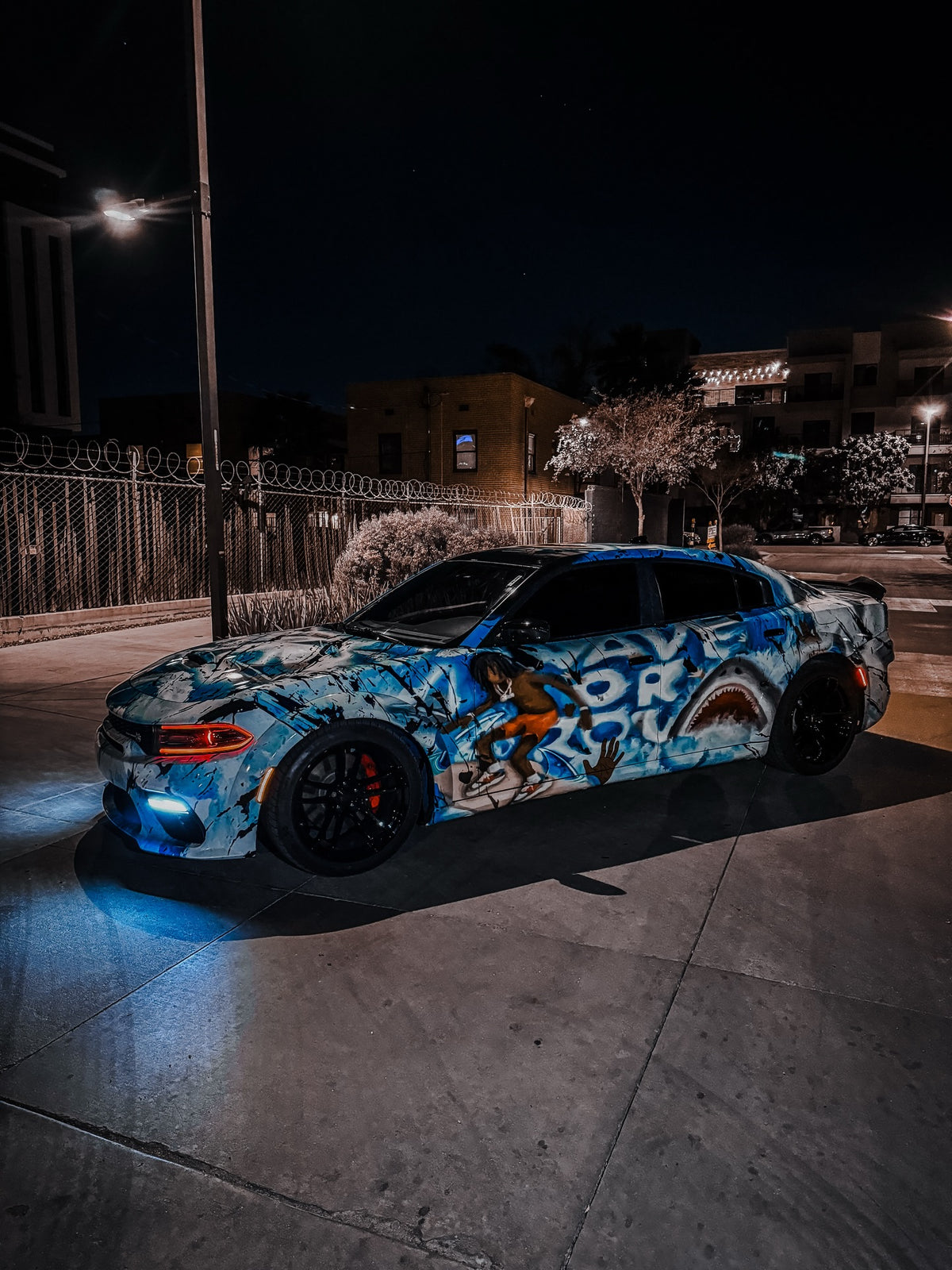 Blue wave show wrap on a Dodge Charger at night, designed by Jay's Car Designs