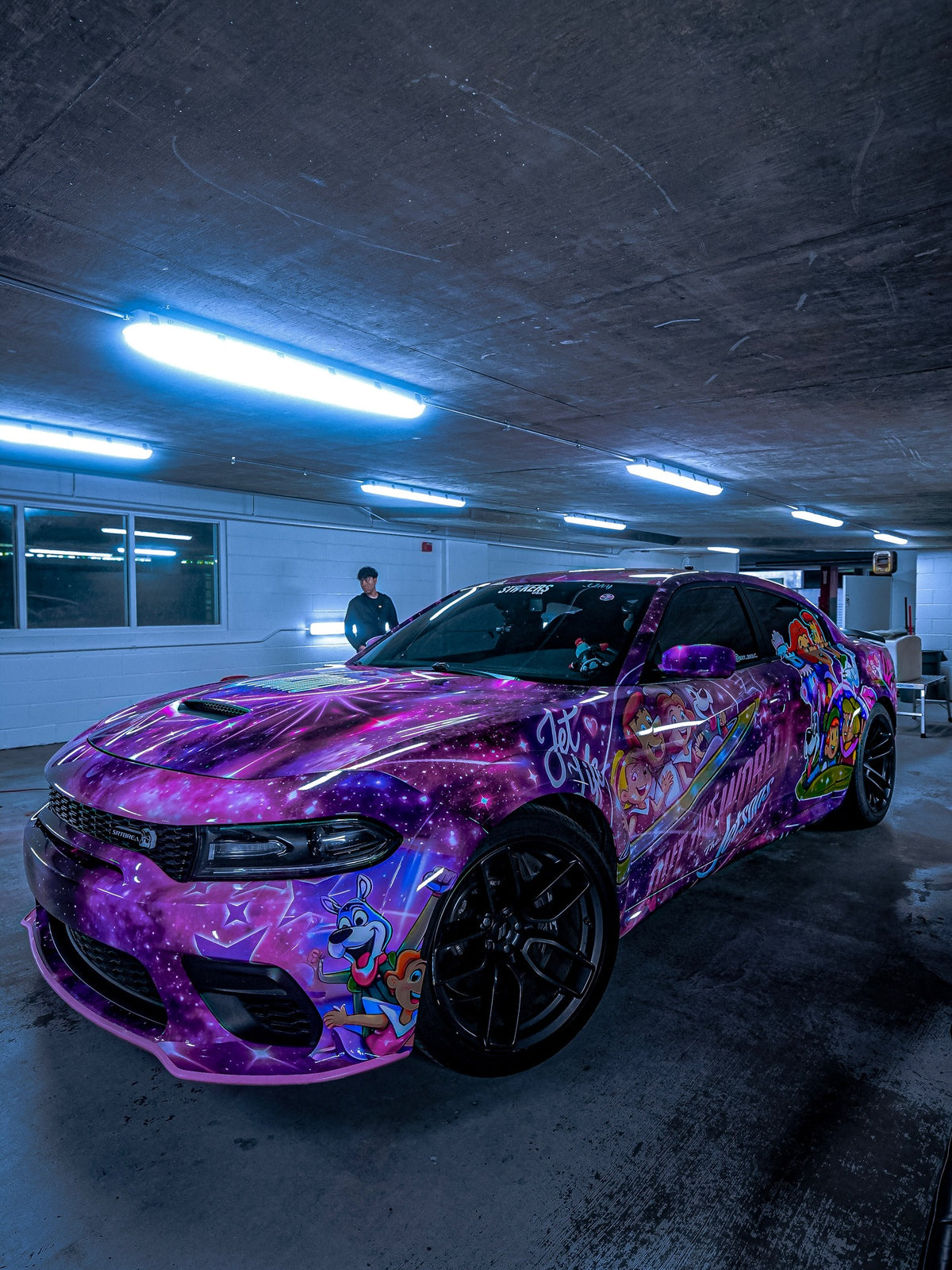 Purple galaxy cartoon show wrap on a Dodge Charger, designed by JCD